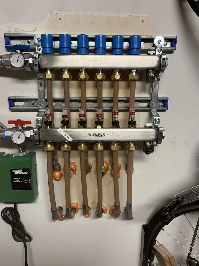 Plumber performing Water Heater Repair at a residential property in Winslow